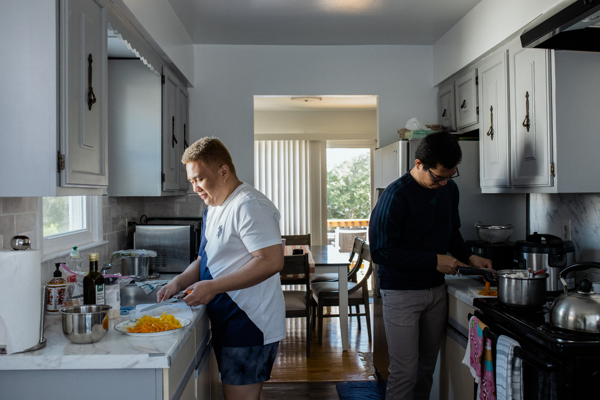 Cruz and Sagun prepare food together at home.