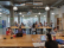 University of Utah students convene in the open-community innovation space on the ground floor of Neeleman Hangar at Lassonde Studios