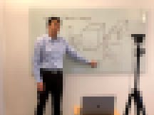 Andrew Ng teaching from home easel whiteboard setup