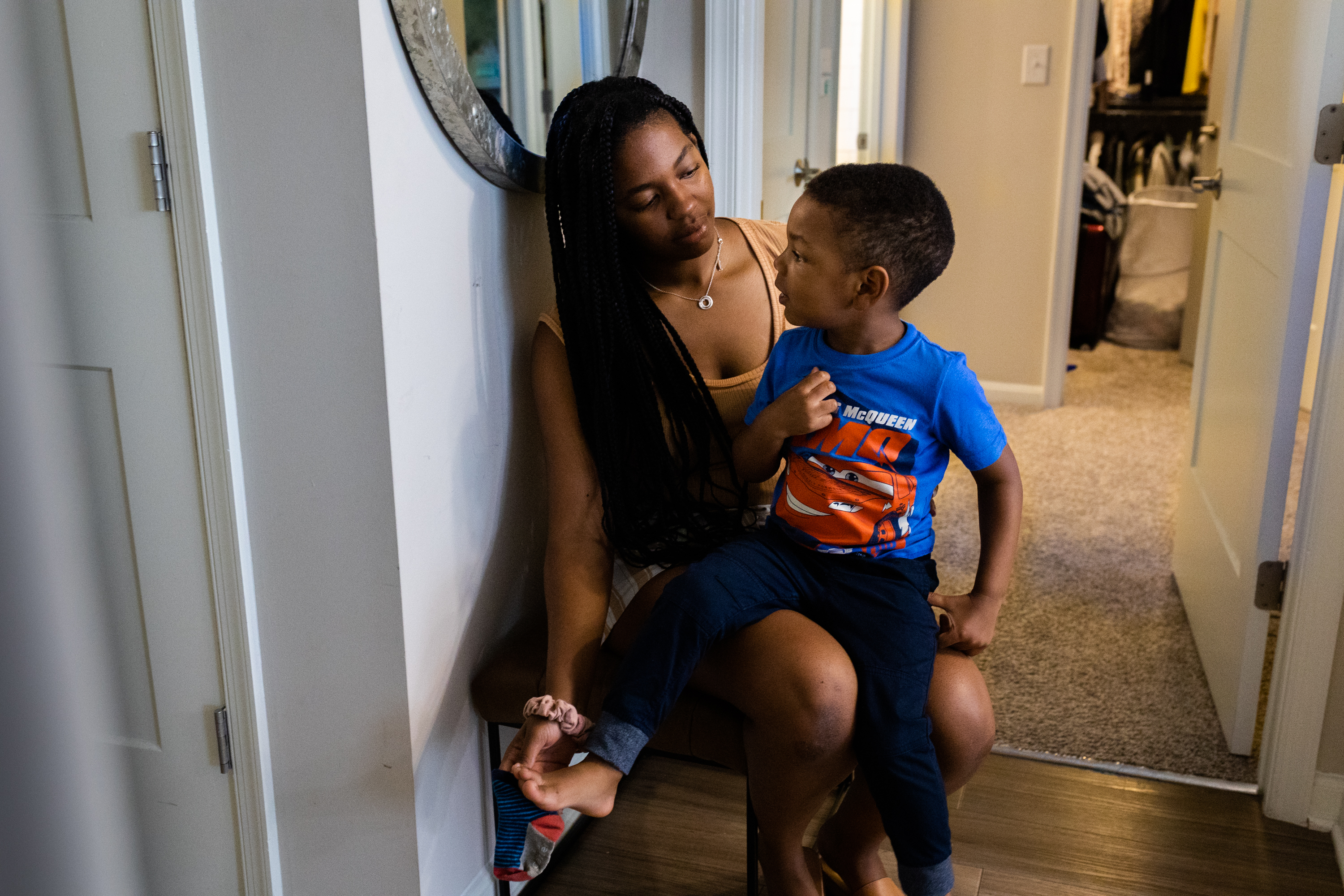 Sarah and Noah put on sock and shoes