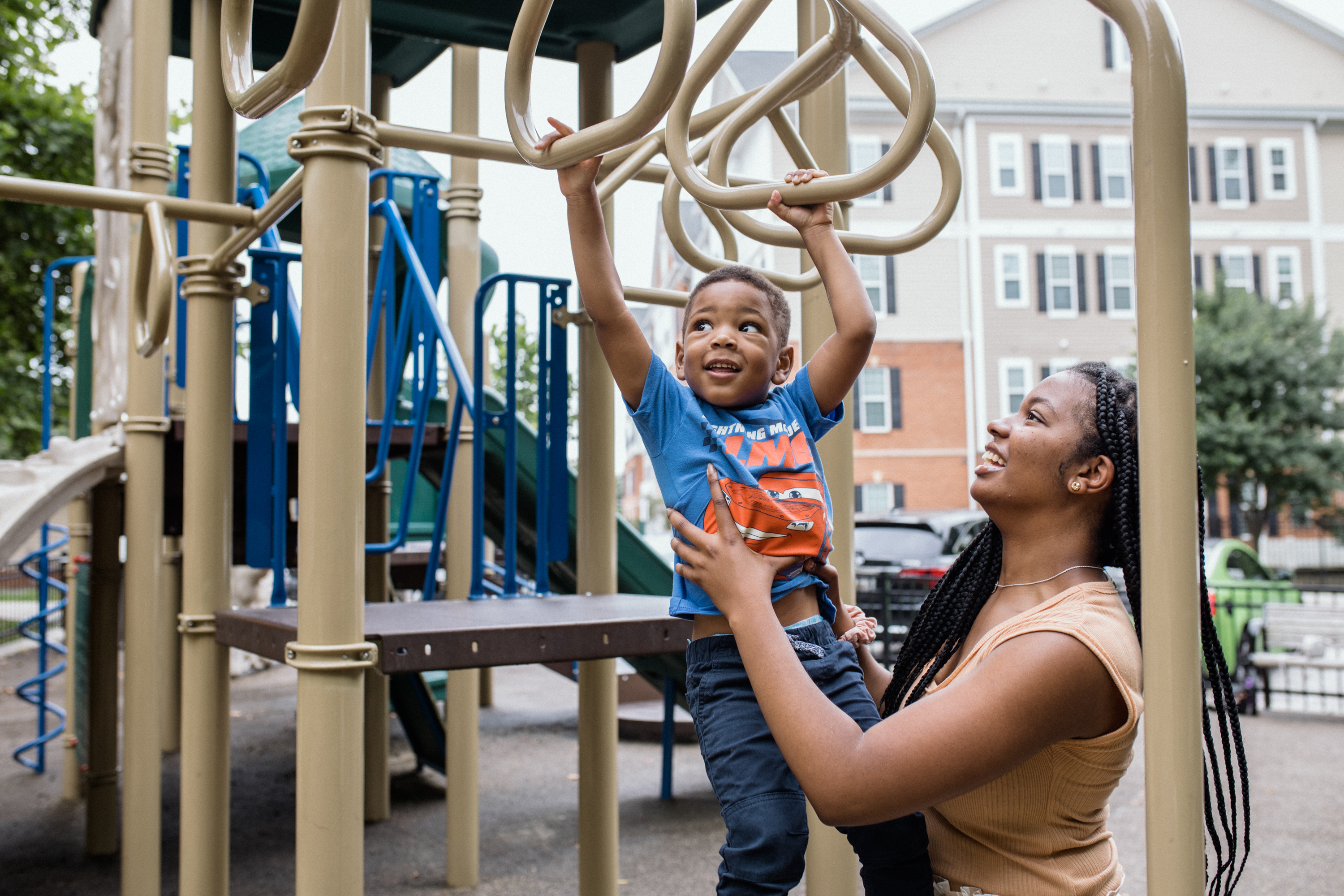 Sarah and Noah play on the playground