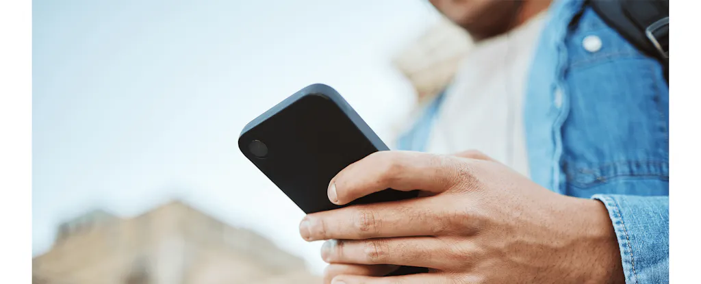 Student holding smart phone