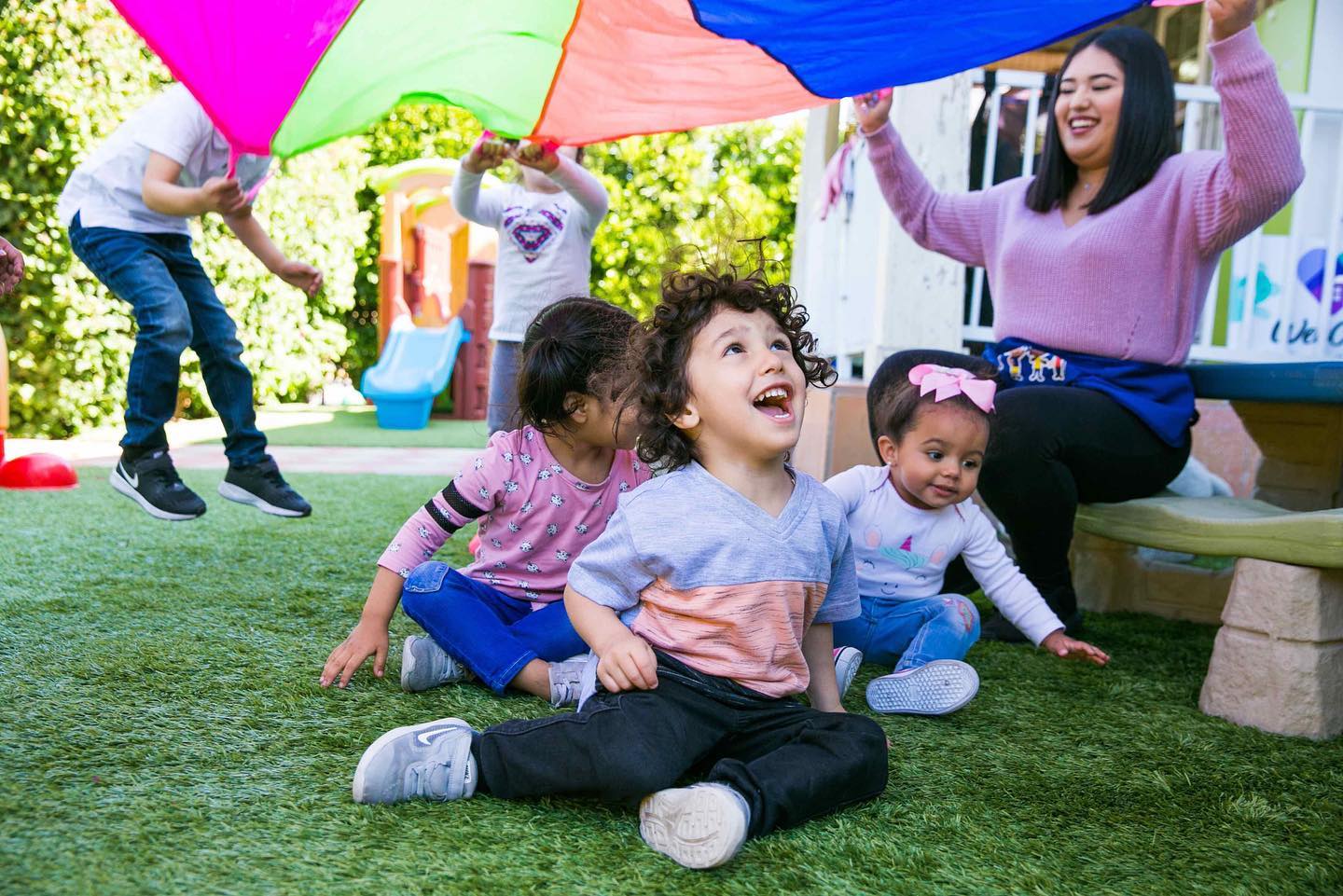 Children and their caregivers at Mundy Family WeeCare, an in-home provider in Los Angeles. Photos courtesy of WeeCare.