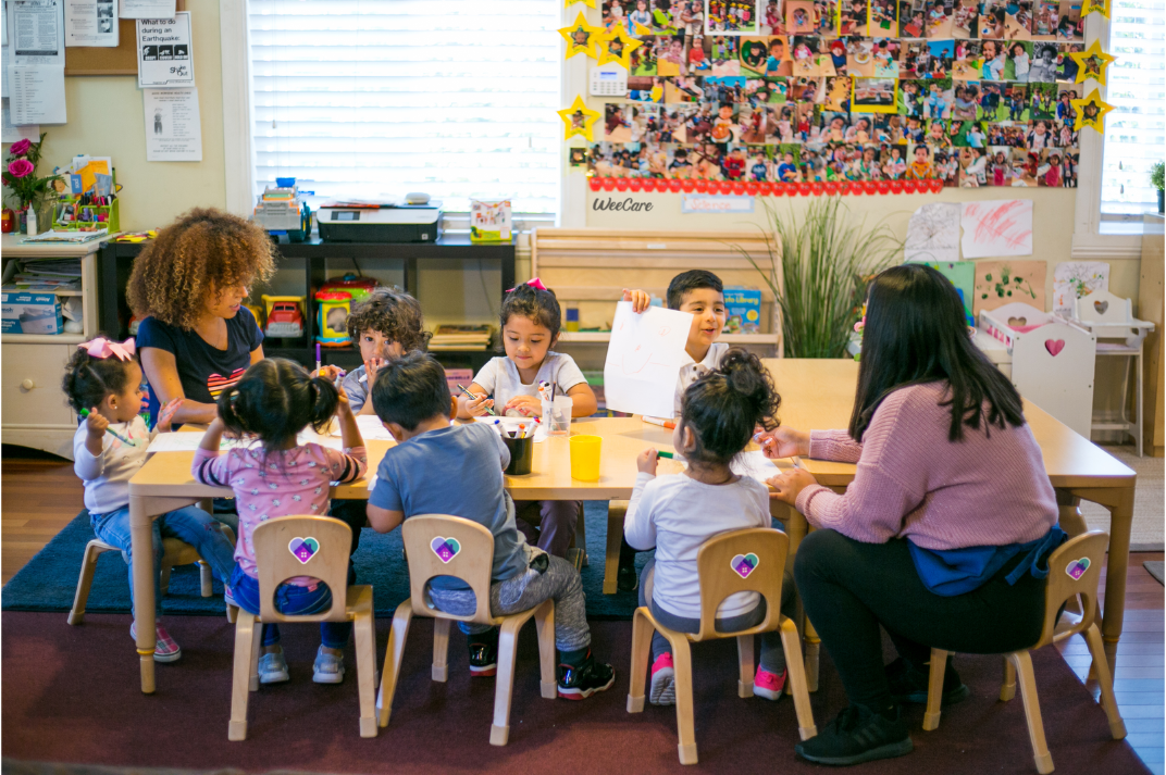 Children and their caregivers at Mundy Family WeeCare, an in-home provider in Los Angeles. Photos courtesy of WeeCare.