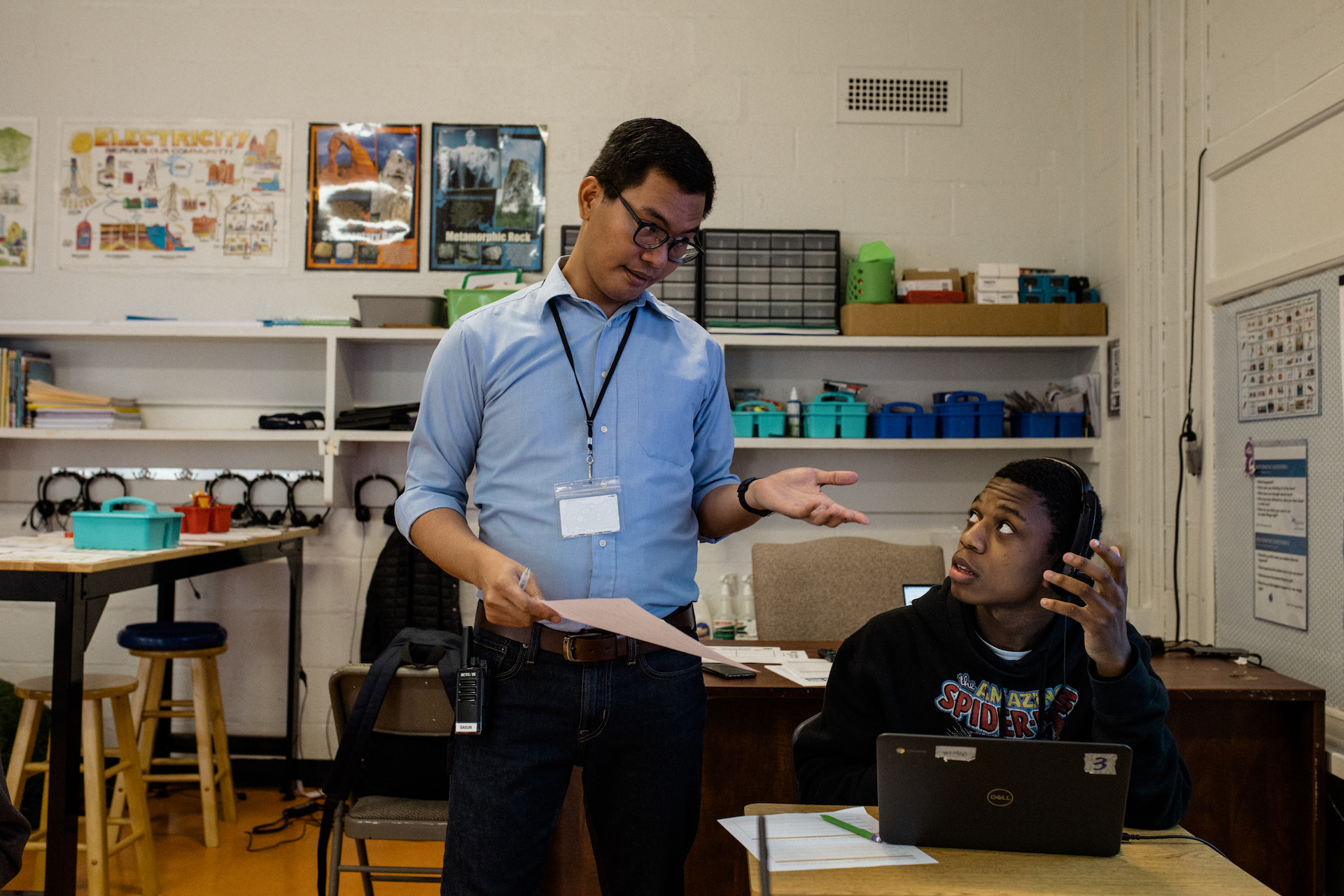 Sagun guides Kevin Wendell Dean Jr. during a science class exercise.