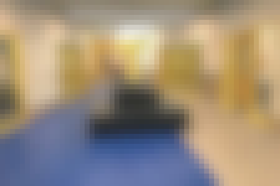 Classrooms have garage doors — a nod to the schools’ original Open Education Movement design — that teachers can open when they want their students to collaborate. Photo by Nadia Tamez-Robledo for EdSurge.