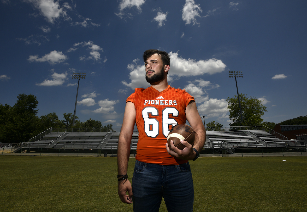 Dino with a football