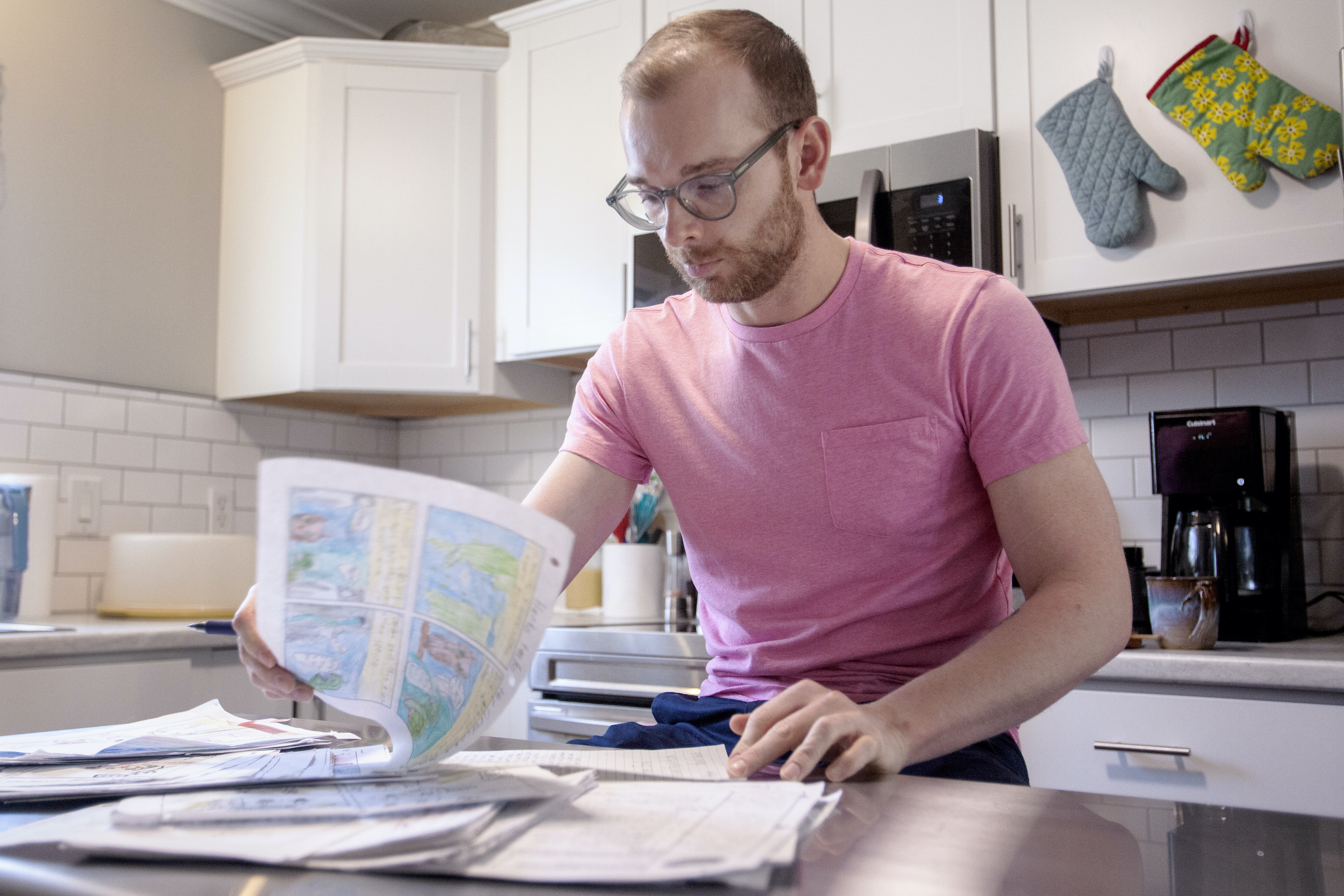 Marcus Blankenship, a sixth grade history teacher, gives student feedback after school. Photo by Angela Wilhelm for EdSurge.